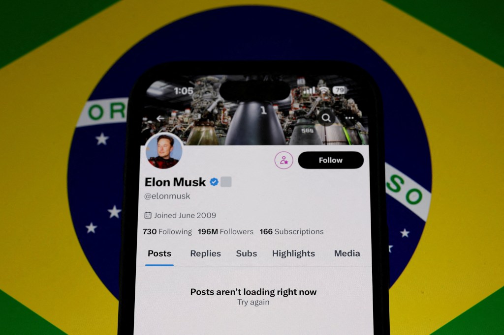 Elon Musk's X social network account blocked, shown on a mobile screen, after suspension by Brazil's telecoms regulator